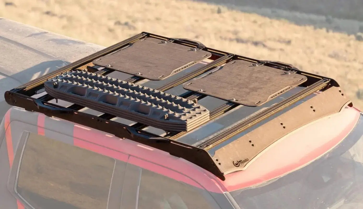 Close-up of Prinsu roof rack on Toyota Sequoia 2023, showcasing mounted recovery boards and modular design for outdoor gear.