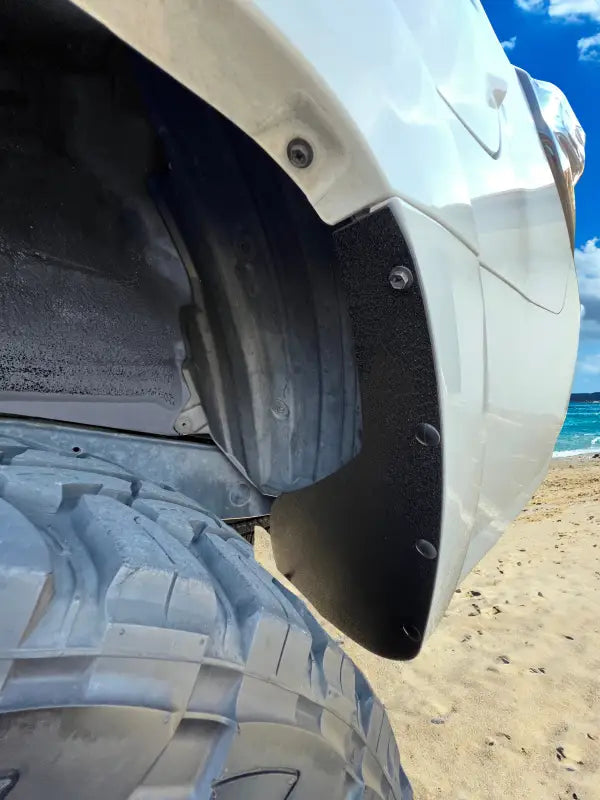 Rear mud flap delete kit installed on a Toyota 4Runner, black with a minimalist design, blending seamlessly with the vehicle.