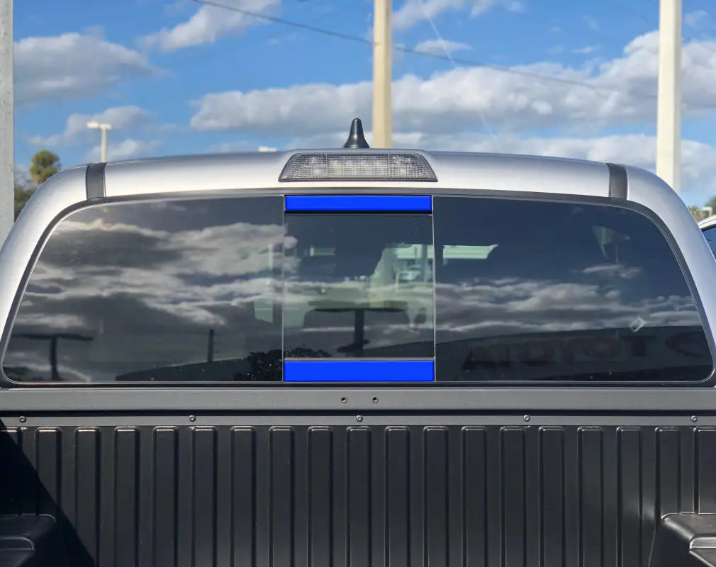 Custom rear power sliding window accent overlays for 2016-2023 Toyota Tacoma, tailored for a personalized exterior design.