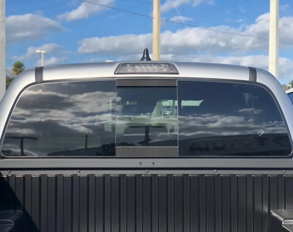 Blue rear power sliding window accent overlays for 2016-2023 Toyota Tacoma, offering a vibrant exterior upgrade.