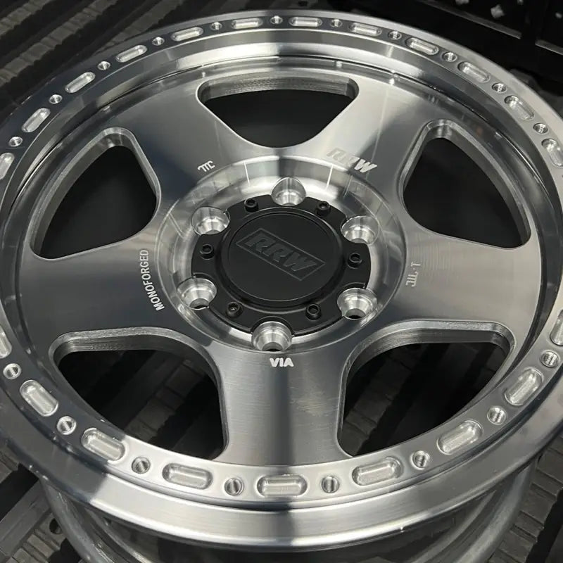Silver aluminum alloy wheel from RG4-H Hybrid MonoForged Wheel series with embossed ABS