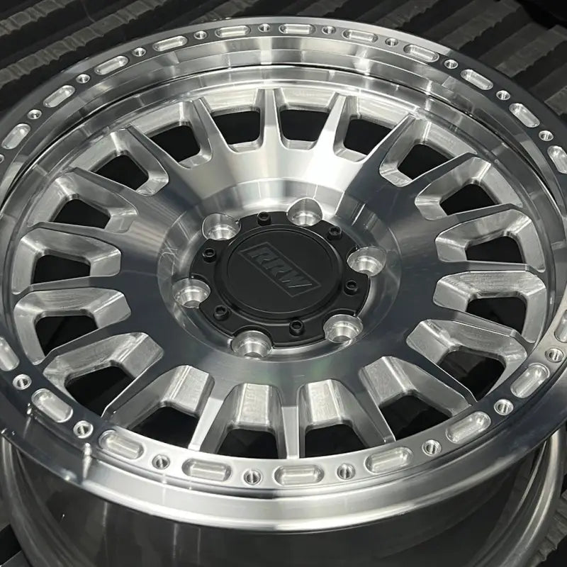 Polished aluminum alloy wheel from RG7-H Hybrid MonoForged Series with embossed ABS and lug nuts