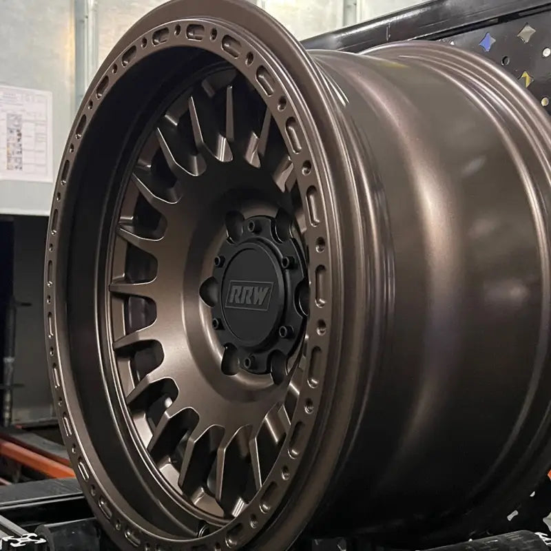 Bronze-colored off-road wheel from RG7-H Hybrid MonoForged Series with embossed ABS and lug nuts