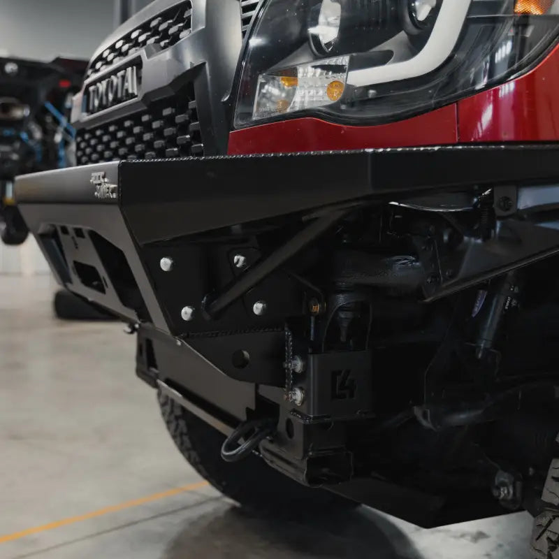 Close-up of the Tacoma Rock Runner bumper's corner, showcasing its bolt-on wings and rugged construction for 2005-2015 models.