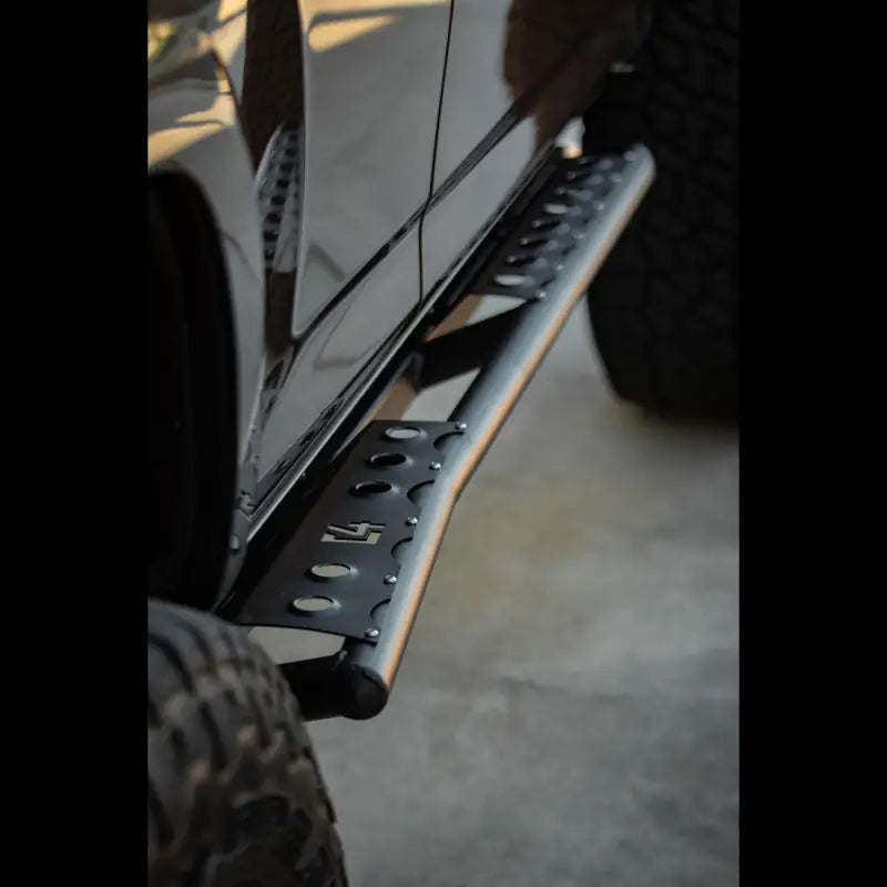 Side view of 4Runner Rock Sliders for 2010-2013 models, showcasing a sleek bolt-on design with reinforced steel and no welding required.