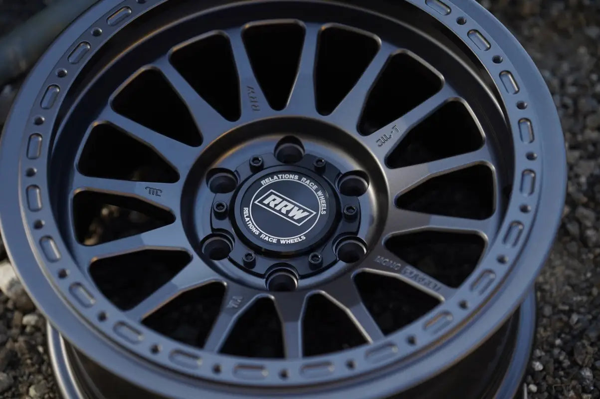 Gray off-road wheel from RS7-H Hybrid MonoForged Series with lug nuts and center caps