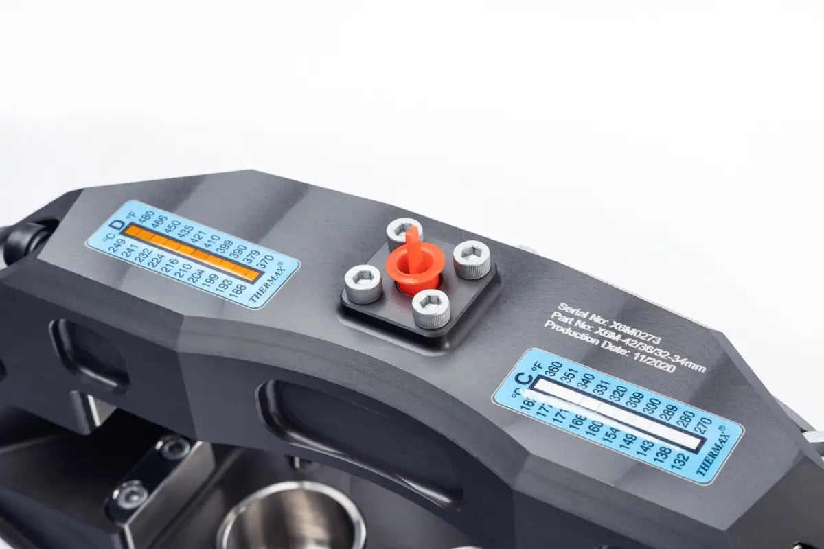 Top view of the PowerBrake 6 piston caliper with technical specifications and bleed screw for optimal performance.
