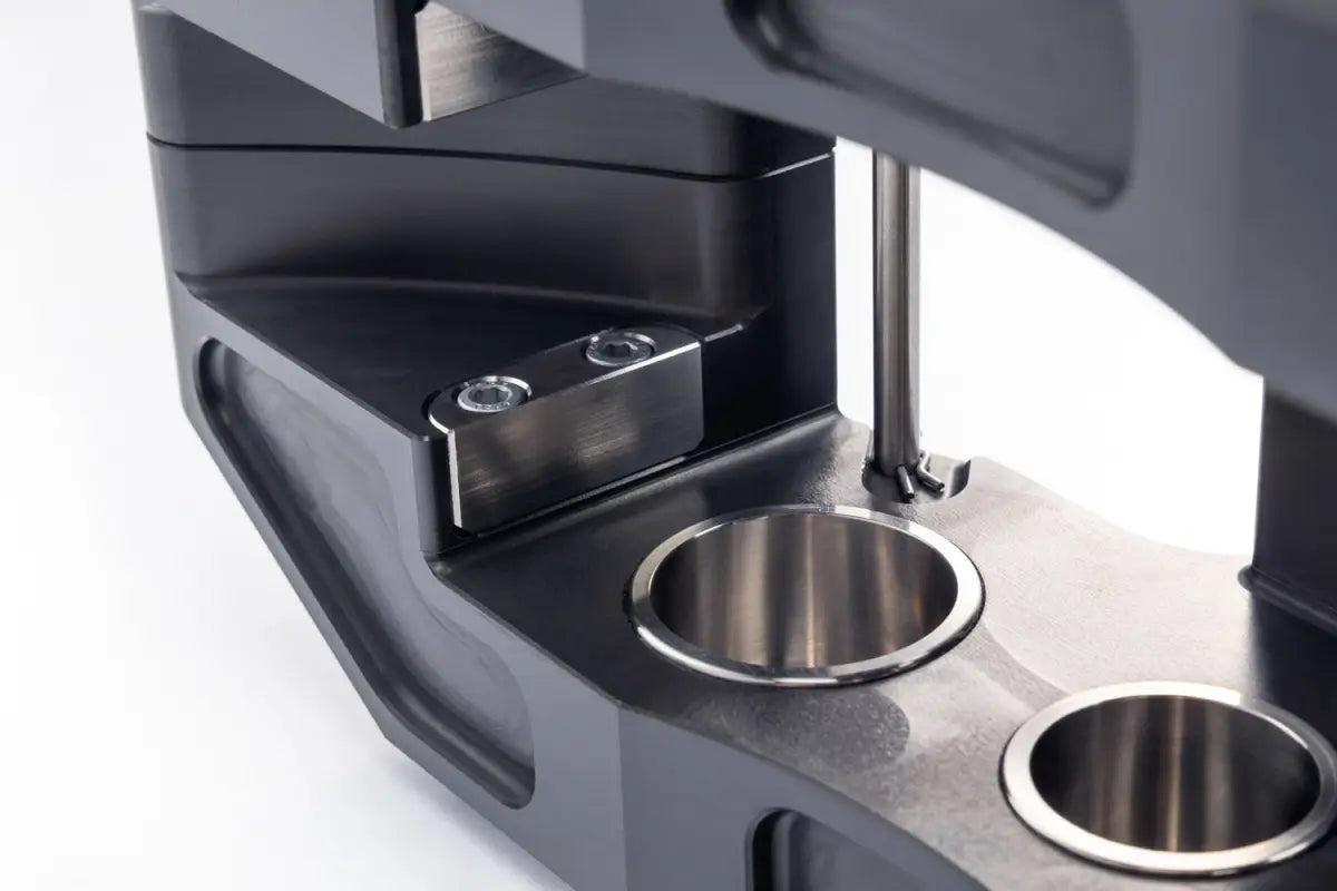 Interior view of the PowerBrake 6 piston caliper, highlighting the stainless steel pistons and high-quality construction.
