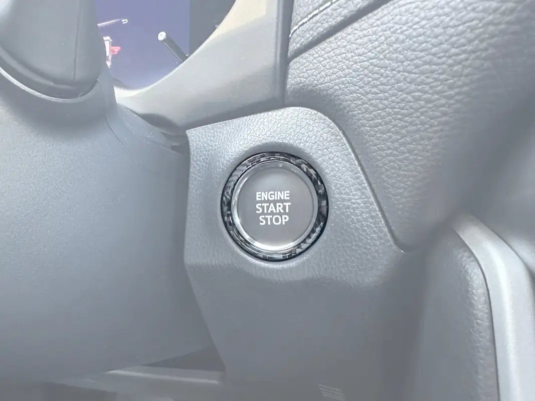 Start Button Accent Trim installed on a 2019-2024 Toyota Rav4, enhancing the engine start/stop button area with a sleek decorative design.