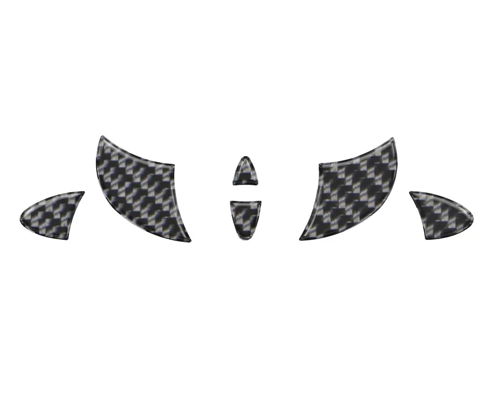 Carbon fiber-patterned steering wheel emblem inserts designed for 2024 Toyota Tacoma, offering a sleek and modern interior upgrade.