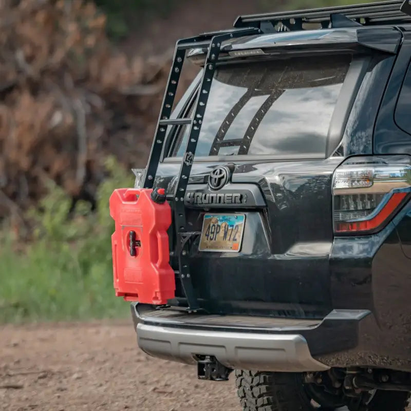 Side view of 4Runner Hatch Ladder - Aluminum with red fuel canister on a 5th Gen 4Runner. Powder-coated and roof rack compatible.