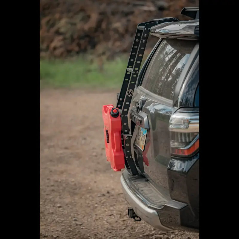 Close-up of 4Runner Hatch Ladder - Aluminum with red fuel canister on a 5th Gen 4Runner. Durable, powder-coated, and roof rack compatible.