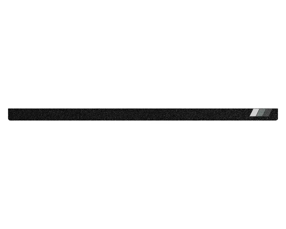 Black textured tailgate protection overlay with gray accents for 2005-2015 Toyota Tacoma, combining style and durability.