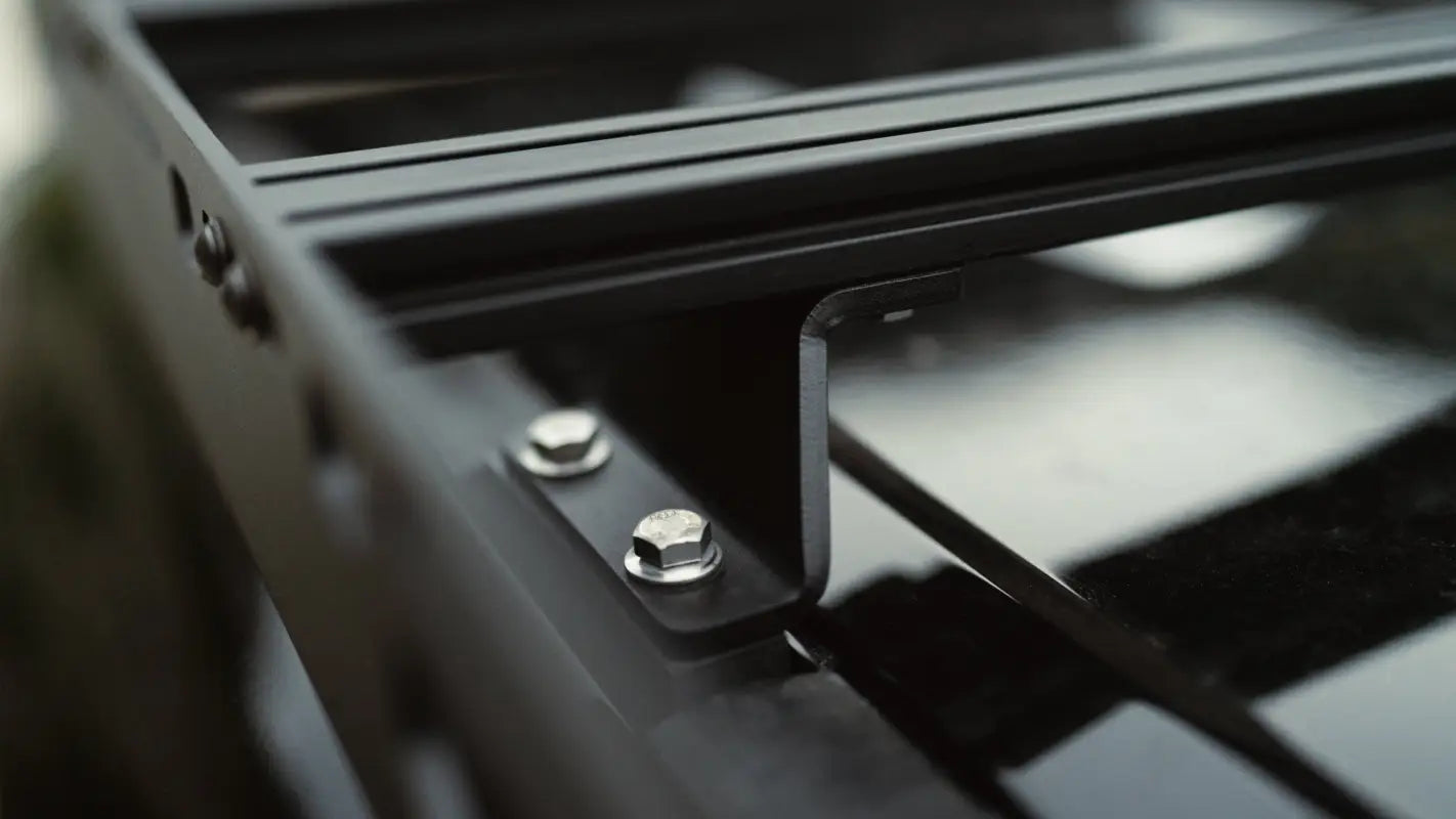 Detailed view of The Atlas roof rack mounting hardware, showcasing its sturdy stainless steel construction for secure installation.