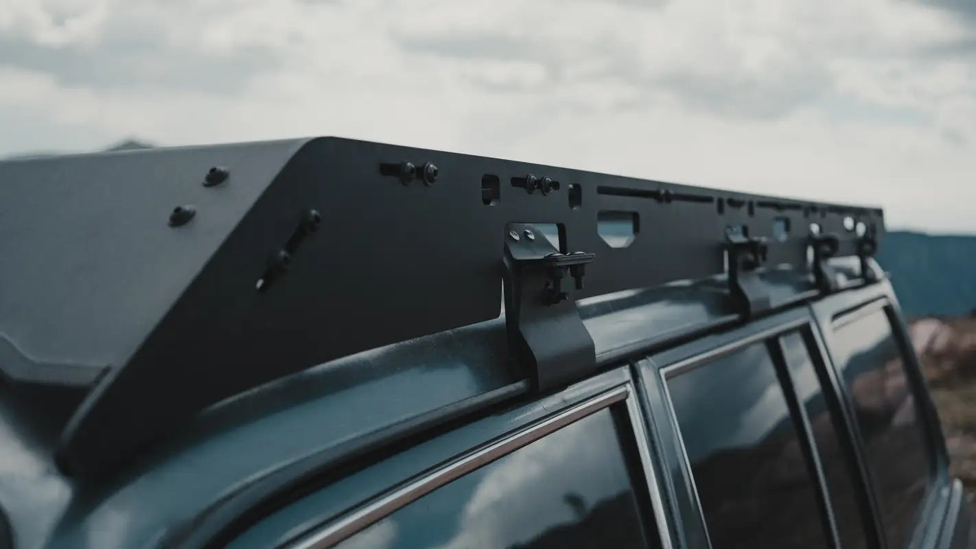 Close-up of the roof rack's mounting system on a Land Cruiser 60 Series, emphasizing its durability and ease of installation.