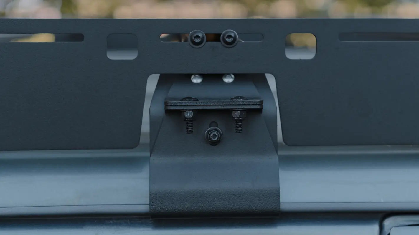 Detailed view of the mounting bracket on the Land Cruiser roof rack, showcasing its drill-free installation and secure fit.