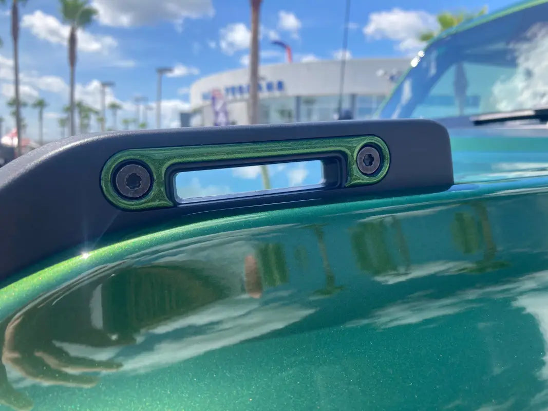 Green vehicle roof rack with integrated light and Trail Sight Inserts for Ford Bronco
