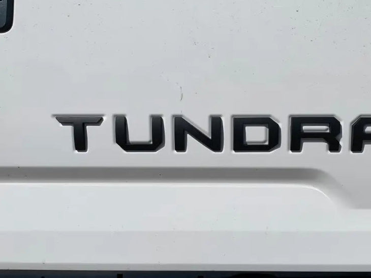 White Toyota Tundra tailgate with custom tundra overlays and tundra tailgate insert