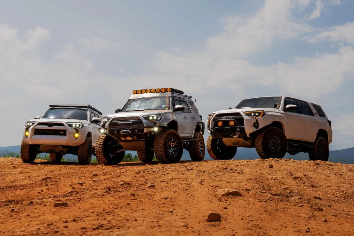 Three modified Toyota 4Runners with XB Evo Headlights featuring high beam and turn signals