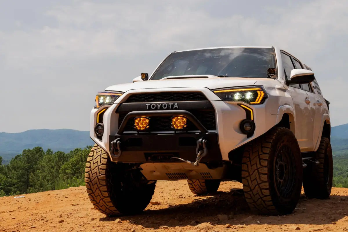 White Toyota 4Runner with XB Evo Headlights for 14-24 featuring high beam and turn signals