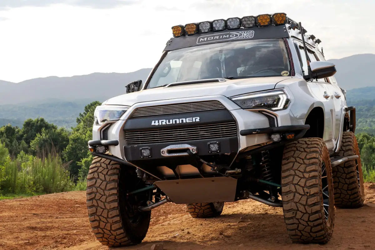 Modified silver 4Runner off-road vehicle with XB Evo Headlights featuring high beam and turn signals