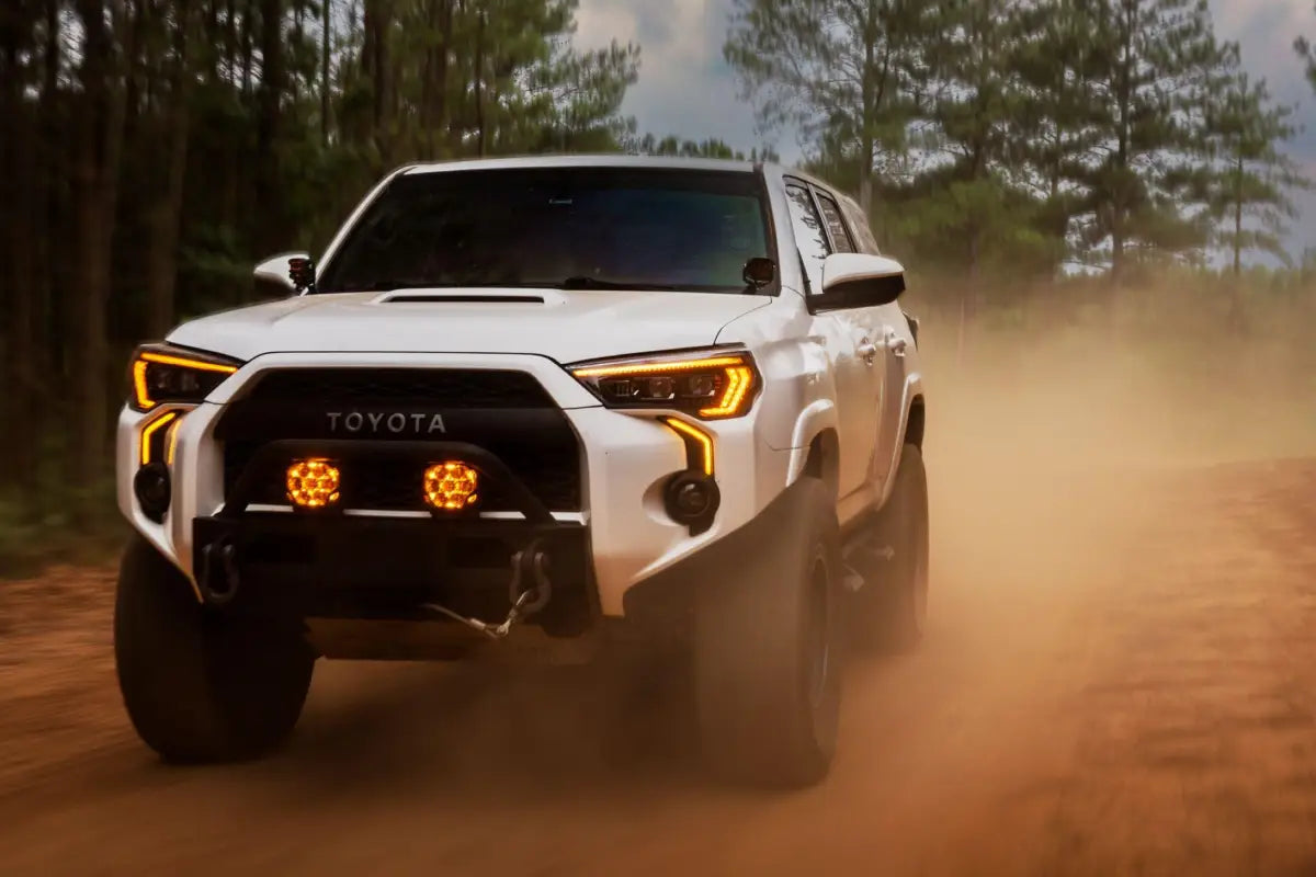 White Toyota 4Runner with XB Evo Headlights featuring high beam and turn signals for off-road use