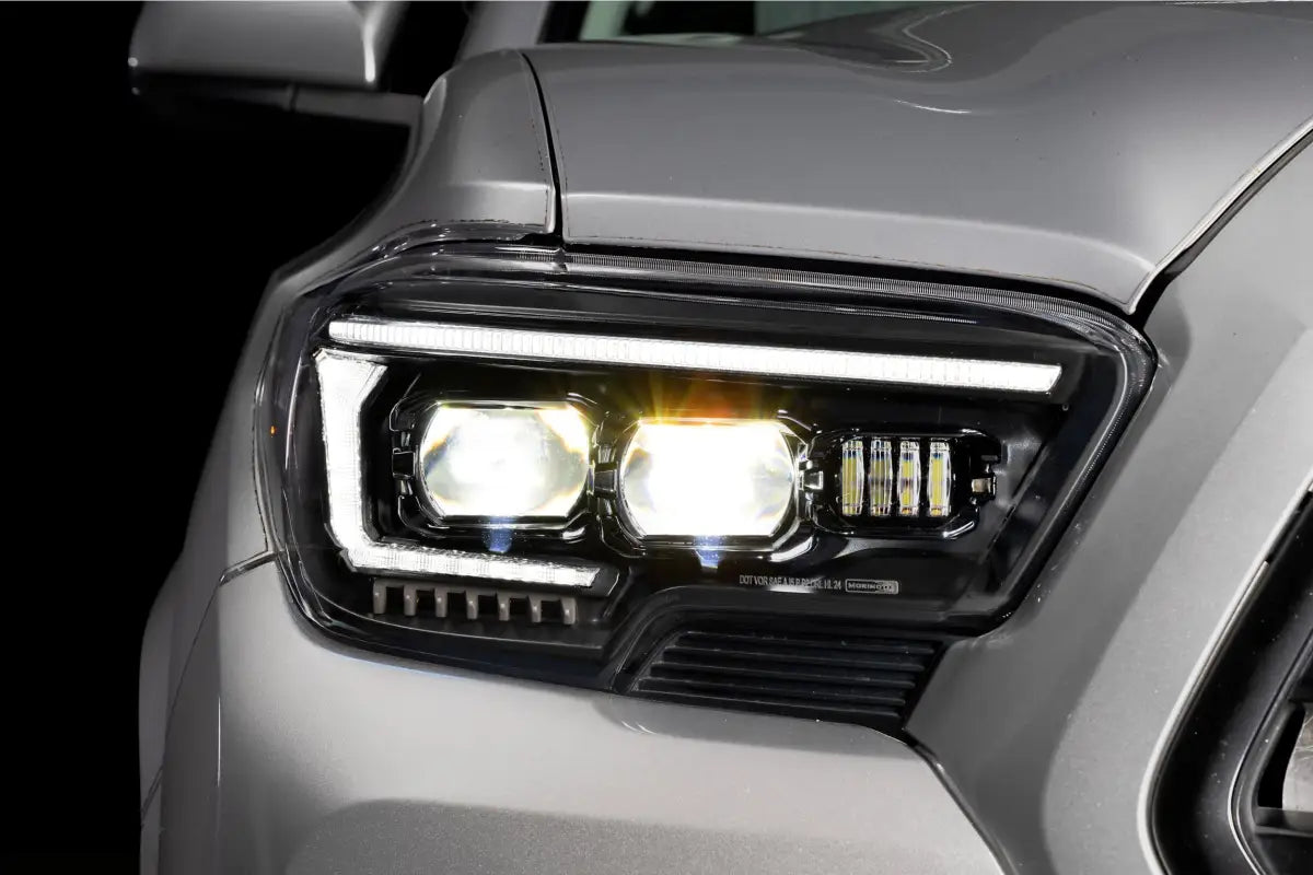 Illuminated XB Evo Headlights for 16-23 Tacoma showcasing high beam and turn signals