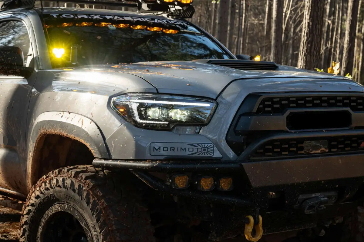 Gray Toyota Tacoma off-road truck with XB Evo Hybrid Headlights for 16-23 Tacoma