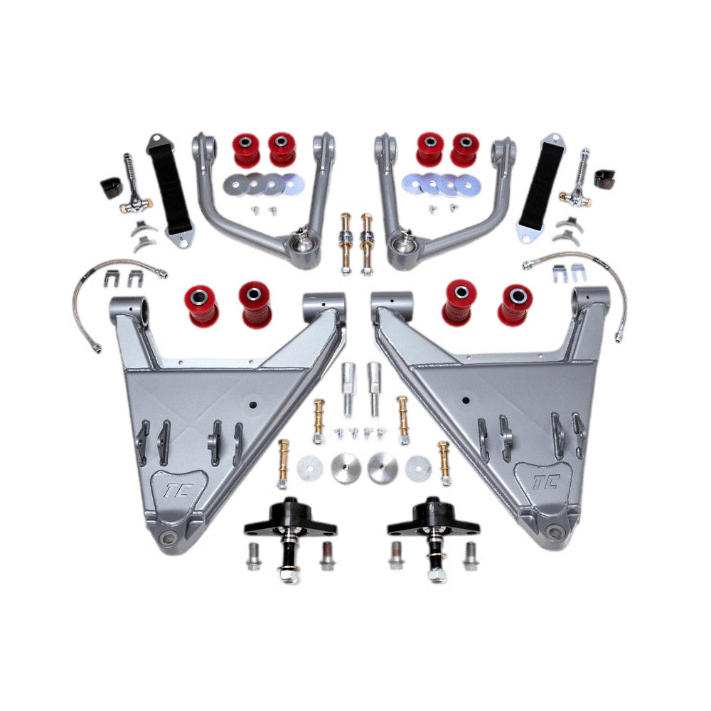 Total Chaos Long Travel Kit for 2005-2015 Toyota Tacoma featuring +2 inch track width, uniball joints, urethane bushings, and CNC machined adapters. Designed for enhanced off-road suspension performance.